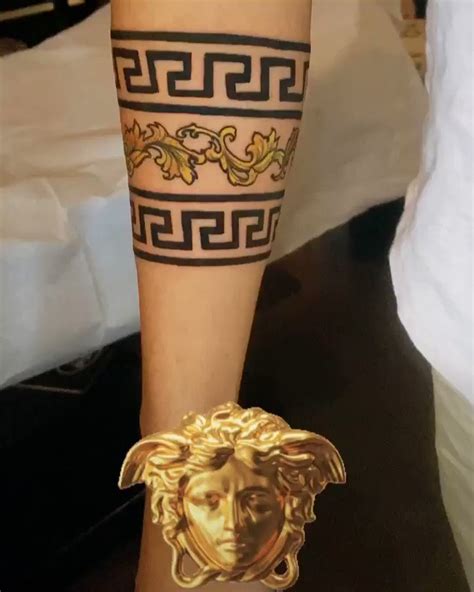 versace symbol tattoo|Versace tattoo lettering.